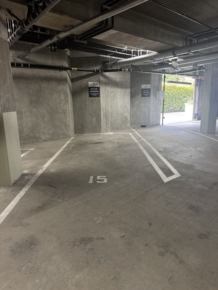Parking spaces marked with Retail Parking signs